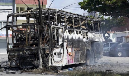 A burned-out bus in the city of Navidad.