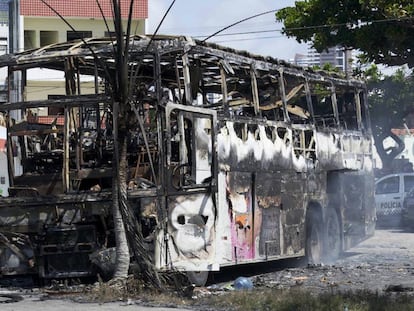 A burned-out bus in the city of Navidad.
