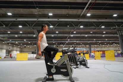 Pawel, a 32-year-old Pole, uses a stationary bike loaned to the shelter.