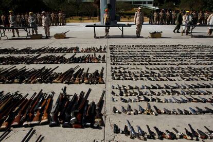 Mexican military displays guns confiscated from drug trade in Tijuana.