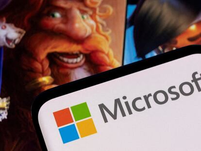 Microsoft logo is seen on a smartphone placed on displayed Activision Blizzard's games characters in this illustration taken January 18, 2022.