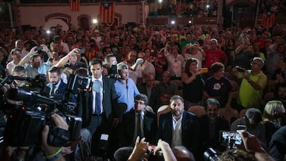 Carles Puigdemont, left, and Oriol Junqueras, center, at the campaign rally.