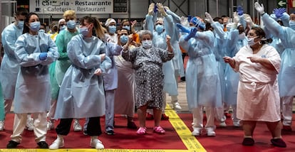 Health workers and patients celebrate the closure of the Ifema field hospital on Friday.