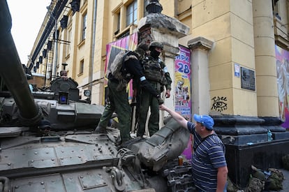 A civilian greets a Wagner mercenary in Rostov. 