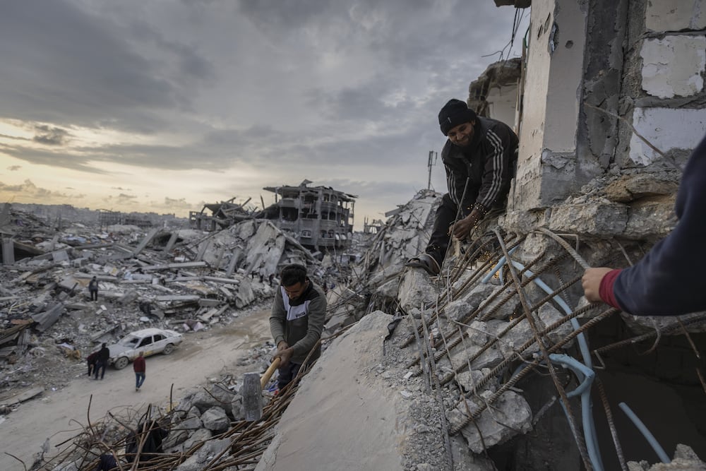 JIBALIA, GAZA - FEBRUARY 20: People continue their daily life under difficult conditions at Jabalia Refugee Camp, located in the north of the Gaza Strip, as they struggle to survive among the rubble of buildings destroyed by Israeli attacks after the ceasefire agreement entered into force in Jabalia, Gaza on February 20, 2025. (Photo by Mahmoud Hamda/Anadolu via Getty Images)