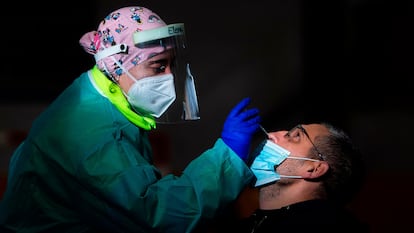 A health worker conducts an antigen test in Tui, in northwestern Spain.