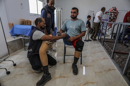 A man tries out a prosthetic leg in Rafah, Gaza, on May 5.