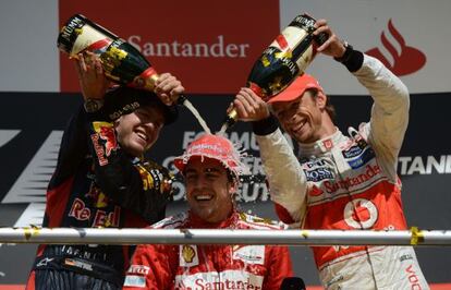 Fernando Alonso receives the traditional champagne dousing after his German GP win.