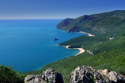Panoramic view of the coast where the steep mountainsides of the Arrábida range (Portugal) meet the Atlantic Ocean.