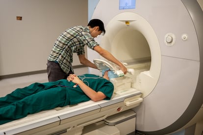 A person undergoes a brain scan.