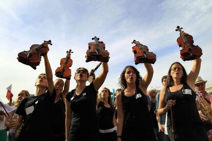 Students and teachers stage a protest against spending cuts for municipal music schools in Madrid. 