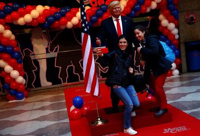 People take a selfie with a life-sized wax statue of U.S. President-elect Donald Trump during an unveiling ceremony at Madrid's wax museum in Madrid, Spain, January 17, 2017. REUTERS/Susana Vera