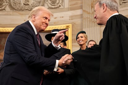 Donald Trump greets Supreme Court Chief Justice John Roberts on Inauguration Day, January 20.
