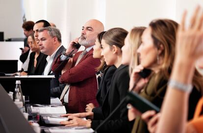 Specialists on the phone during the auction. In a burgundy jacket, Alexandre Ghotbi, head of watches for Europe and the Middle East at Bacs & Russo.