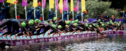 Athletes begin triathlon.