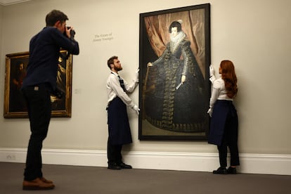 Gallery assistants position a portrait of "Isabel de Borbon, Queen of Spain" by Spanish artist Diego Valazquez, at a press preview in London on December 1, 2023