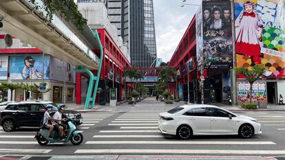 People ride a scooter on a street in Taipei, Taiwan August 10, 2022. REUTERS/Aleksander Solum