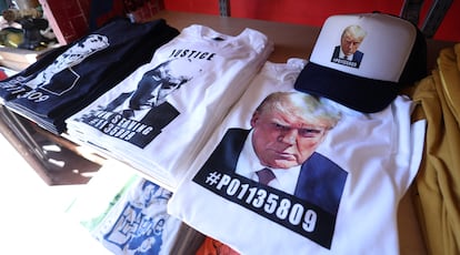 T-shirts and caps that use the image of Donald Trump's Atlanta mugshot, in a Los Angeles store.
