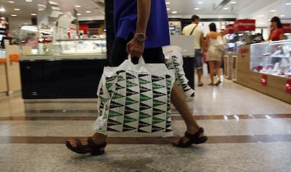 A customer in one of the many branches of El Corte Inglés, the Spanish chain of department stores.