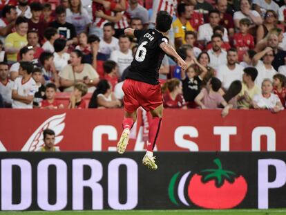 Athletic Bilbao's Spanish midfielder Mikel Vesga celebrates scoring his team's first goal during the Spanish League football match between Sevilla FC and Athletic Club Bilbao at the Ramon Sanchez Pizjuan stadium in Seville on October 8, 2022. (Photo by CRISTINA QUICLER / AFP)