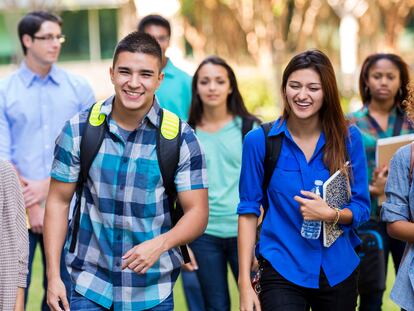 Diverse high school or college students walking on campus