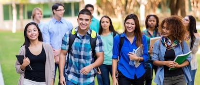 Diverse high school or college students walking on campus