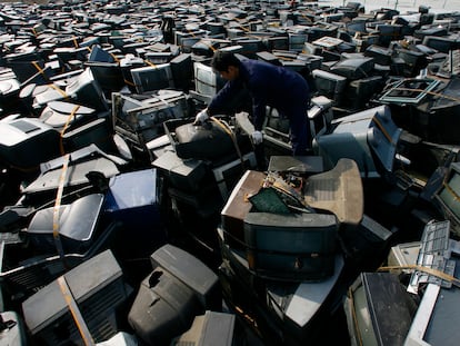 Workers at an electronic waste recycling factory in Hubei, China.