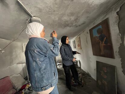 Nidaa Abu Hasna films her short film ‘Out of the Frame’ in a gallery destroyed by the Israeli bombardment of a residential building in Gaza City, in the northern region of the Gaza Strip, on February 9, 2024.