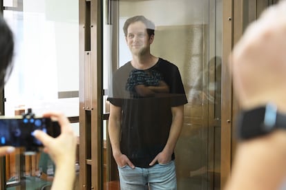 'Wall Street Journal' reporter Evan Gershkovich stands in the glass defendant's booth in a courtroom at the Moscow City Court in Moscow on June 22, 2023. 