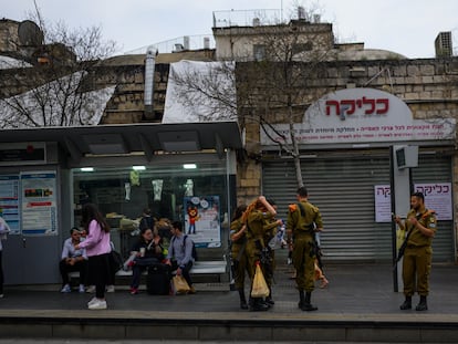 Israel Defense Forces soldiers guard Jerusalem's Machane Yehuda market on March 29.