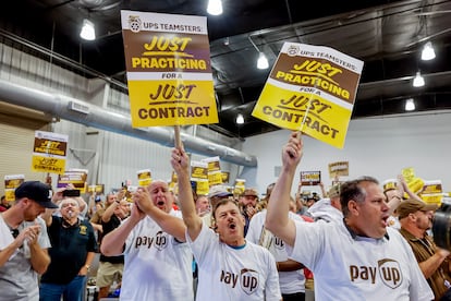 Members and supporters of the International Brotherhood of Teamsters participate in a rally ahead of a possible strike against UPS