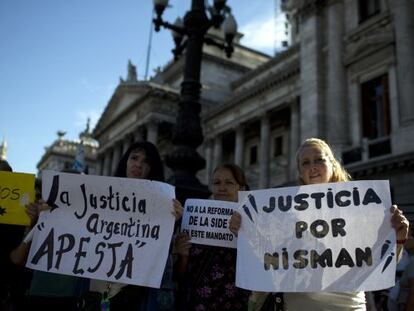 People hold a vigil outside Congress in support of Nisman.