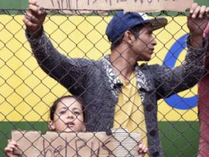 Refugees ask for help at Bicske station, 40 kilometers outside Budapest.