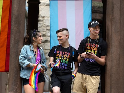 Spectators watch along the Pride parade route, Saturday, June 10, 2023, in Boston. The biggest Pride parade in New England returned on Saturday after a three-year hiatus, with a fresh focus on social justice and inclusion rather than corporate backing. (AP Photo/Michael Dwyer)