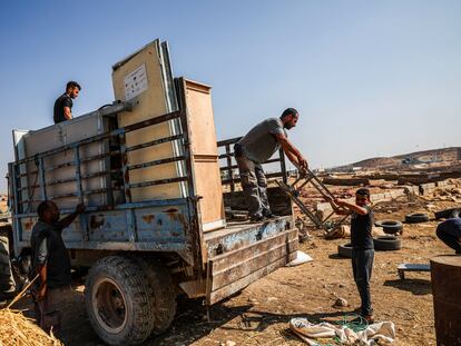 A Palestinian displaced from Khirbet Zanuta moving his belongings on November 1.