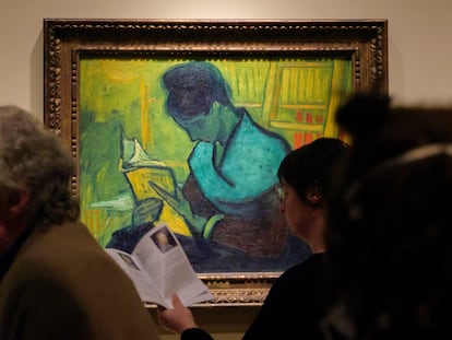 Visitors file past at the Van Gogh painting "Une Liseuse De Romans", also known as "The Novel Reader", during the Van Gogh in America exhibit at the Detroit Institute of Arts, Wednesday, Jan. 11, 2023, in Detroit.