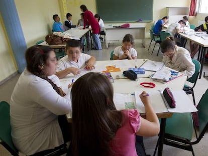 Children in Seville take part in a class organized by the Fundación del Secretariado Gitano.