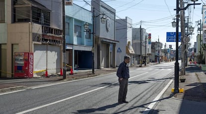 Toyotaka Kanakura, 65, looks at his old florist shop.