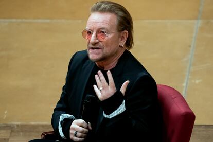 Bono speaks with Cathedral Canon historian Jon Meacham at the Washington National Cathedral on Dec. 5, 2022, in Washington.