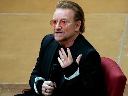 Bono speaks with Cathedral Canon historian Jon Meacham at the Washington National Cathedral on Dec. 5, 2022, in Washington.