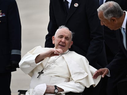 Pope Francis speaks with Portuguese President Marcelo Rebelo de Sousa after landing at the Figo Maduro air base in Lisbon to attend World Youth Day on August 2, 2023.