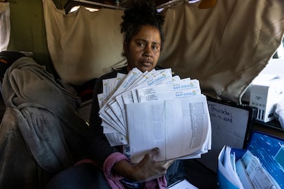 Julienna Endres with the 47 parking tickets that she’s appealing in a San Diego court.