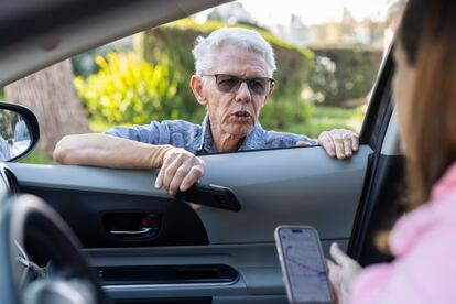 Pasadena homeowner Robert Clearwater calls for help to determine the status of his home damaged by the Eaton fire at a police checkpoint where only emergency services, utility repair companies, authorities and media are allowed through, on January 11, 2025.