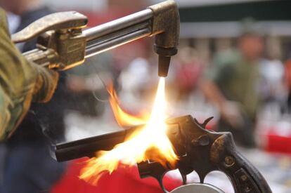 An illegal gun being melted down in Venezuela.