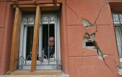 Jesús Pérez, 76, looks out the window of his Lorca home.