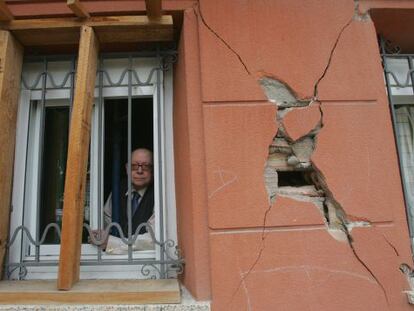 Jesús Pérez, 76, looks out the window of his Lorca home.