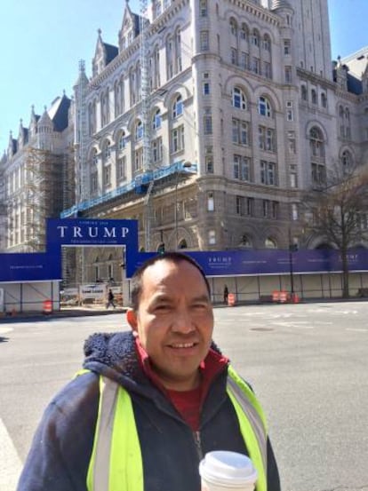 Construction worker Francisco Jiménez, with the hotel in the background.