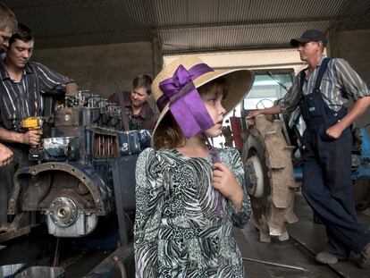 Benjamin Dick's daughter walks inside her father's workshop, which is located in the Riva Palacios Mennonite community in the department of Santa Cruz de la Sierra, Bolivia.