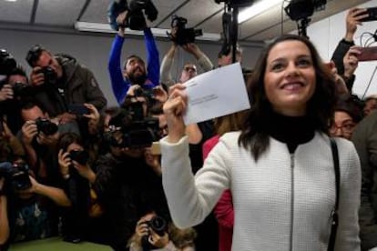 Ciudadanos candidate Ines Arrimadas shows her ballot before casting her vote for the Catalan regional election