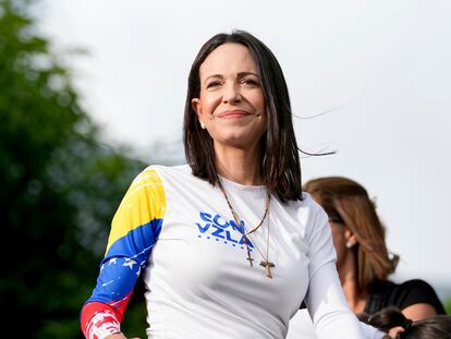 Opposition leader Maria Corina Machado rides atop a truck during a closing election campaign rally of presidential candidate Edmundo Gonzalez in Caracas, Venezuela, Thursday, July 25, 2024. The presidential election is set for July 28. (AP Photo/Matias Delacroix)